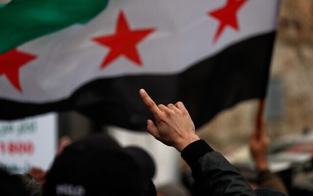 Demonstrators wave a Syrian flag during a march marking the 15th anniversary of the start of the Syrian revolution against the Bashar Assad regime in the Old City of Damascus, March 15, 2026. (AP Photo/Omar Sanadiki) Demonstrators wave a Syrian flag during a march marking the 15th anniversary of the start of the Syrian revolution against the Bashar Assad regime in the Old City of Damascus, March 15, 2026. (AP Photo/Omar Sanadiki)