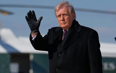 US President Donald Trump waves after arriving on Air Force One, March 18, 2026, at Joint Base Andrews, Maryland, after attending the casualty return at Dover Air Force Base, Delaware, for the six crew members of an Air Force refueling aircraft who died when their plane crashed in western Iraq while supporting operations against Iran. (AP/Julia Demaree Nikhinson)