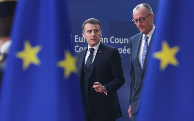 Germany's Chancellor Friedrich Merz, right, and French President Emmanuel Macron walk together as they arrive for the EU summit at the European Council building in Brussels, March 19, 2026. (AP Photo/Omar Havana) Germany's Chancellor Friedrich Merz, right, and French President Emmanuel Macron walk together as they arrive for the EU summit at the European Council building in Brussels, March 19, 2026. (AP Photo/Omar Havana)