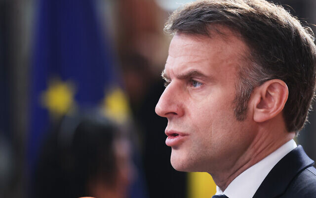 French President Emmanuel Macron speaks with the media as he arrives for the EU summit at the European Council building in Brussels, March 19, 2026. (AP/Omar Havana)