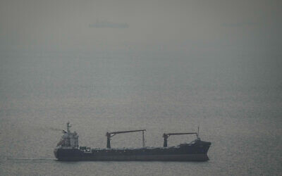 A cargo ship carrying vehicles sails through the Arabian Gulf toward the Strait of Hormuz in the United Arab Emirates, March 22, 2026. (AP) A cargo ship carrying vehicles sails through the Arabian Gulf toward the Strait of Hormuz in the United Arab Emirates, March 22, 2026. (AP)