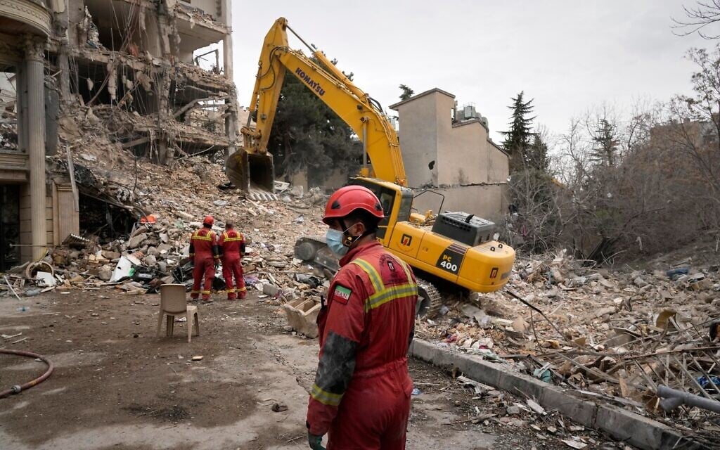 Iranian Red Crescent emergency workers use a bulldozer to clear rubble from a residential building that was hit in a US-Israeli strike in Tehran, Iran, Monday, March 23, 2026. (AP Photo/Vahid Salemi) Iranian Red Crescent emergency workers use a bulldozer to clear rubble from a residential building that was hit in a US-Israeli strike in Tehran, Iran, Monday, March 23, 2026. (AP Photo/Vahid Salemi)