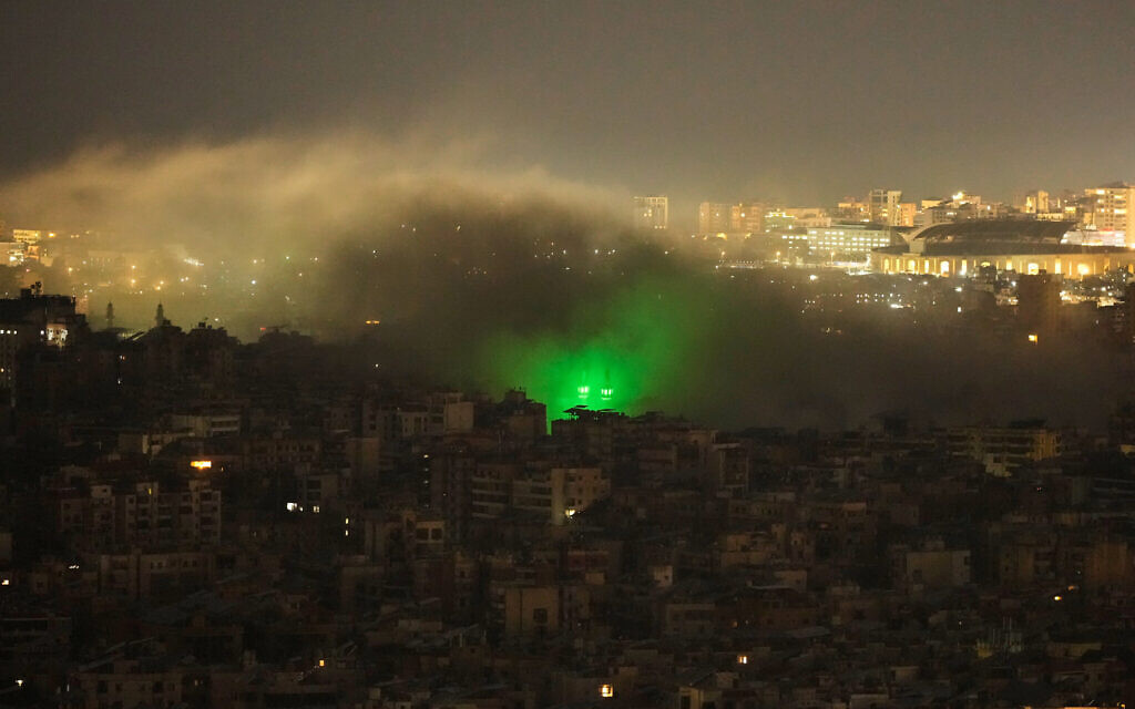 Smoke rises from the site of an Israeli airstrike in Dahiyeh, Beirut's southern suburbs, March 23, 2026. (AP Photo/Hassan Ammar)