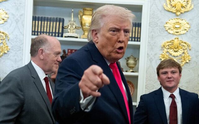 US President Donald Trump speaks with reporters in the Oval Office of the White House, in Washington, March 24, 2026. (AP/Alex Brandon)