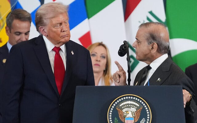 US President Donald Trump, left, listens as Pakistan's Prime Minister Shehbaz Sharif speaks during a summit to support ending the more than two-year Israel-Hamas war in Gaza after a breakthrough ceasefire deal, on October 13, 2025, in Sharm El Sheikh, Egypt. (AP Photo/Evan Vucci, File)