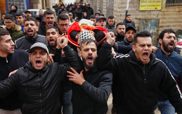 Mourners carry the body of Palestinian Mustafa Hamad, 22, during his funeral in the West Bank refugee camp of Qalandiya, March 27, 2026. (AP Photo/Mahmoud Illean) Mourners carry the body of Palestinian Mustafa Hamad, 22, during his funeral in the West Bank refugee camp of Qalandiya, March 27, 2026. (AP Photo/Mahmoud Illean)