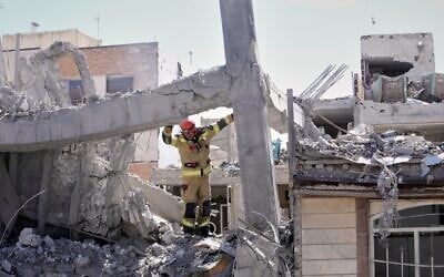 A first responder inspects the damaged structure of a residential building hit in an earlier US-Israeli strike in Tehran, March 27, 2026. (AP Photo/Vahid Salemi) A first responder inspects the damaged structure of a residential building hit in an earlier US-Israeli strike in Tehran, March 27, 2026. (AP Photo/Vahid Salemi)