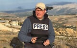 Hezbollah's al-Manar TV correspondent Ali Shoeib, who was killed in an Israeli strike in Jezzine along with another journalist on March 28, 2026, is seen reporting in the town of Marjayoun, November 2, 2024. (AP Photo/Hussein Malla)