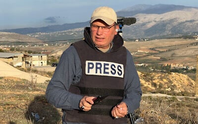 Hezbollah's al-Manar TV correspondent Ali Shoeib, who was killed in an Israeli strike in Jezzine along with another journalist on March 28, 2026, is seen reporting in the town of Marjayoun, November 2, 2024. (AP Photo/Hussein Malla)