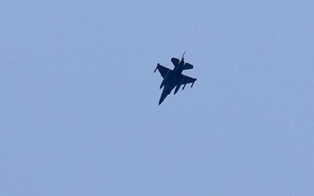 An Israeli F-16 fighter jet flies over the southern Lebanese port city of Tyre, March 28, 2026. (AP Photo/Hussein Malla)