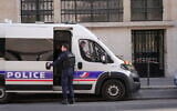 Police stand outside the Bank of America building in Paris, March 28, 2026. (AP/Nicolas Garriga)