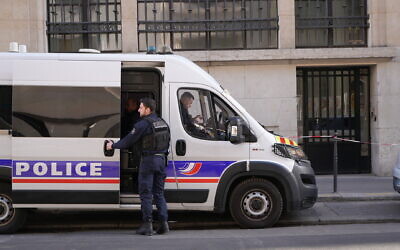 Police stand outside the Bank of America building in Paris, March 28, 2026. (AP/Nicolas Garriga)