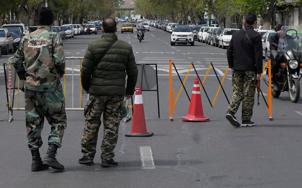 Members of the Basij paramilitary force stand at a checkpoint in Tehran, Iran, March 29, 2026. (AP Photo/Vahid Salemi)