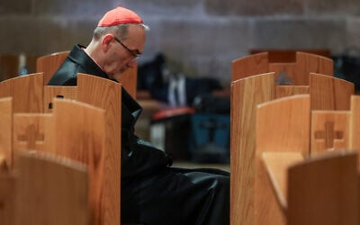 Cardinal Pierbattista Pizzaballa, the Latin Patriarch of Jerusalem, sits in the Church of All Nations on the day of a prayer service to mark Palm Sunday in Jerusalem, Sunday, March 29, 2026. (Ammar Awad/Pool Photo via AP)
