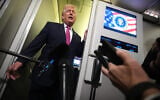 US President Donald Trump speaks to reporters aboard Air Force One en route from West Palm Beach, Florida, to Joint Base Andrews, Maryland, March 29, 2026. (AP/Mark Schiefelbein)