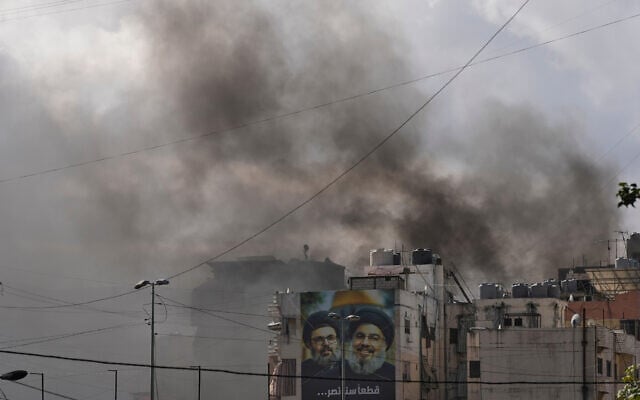 Illiustration: Portraits of Hezbollah's late leaders Hassan Nasrallah, right, and his cousin, Hashem Safieddine, are seen as smoke rises following an Israeli airstrike in Dahiyeh, Beirut's southern suburbs, March 30, 2026. (AP/Hassan Ammar) Illiustration: Portraits of Hezbollah's late leaders Hassan Nasrallah, right, and his cousin, Hashem Safieddine, are seen as smoke rises following an Israeli airstrike in Dahiyeh, Beirut's southern suburbs, March 30, 2026. (AP/Hassan Ammar)