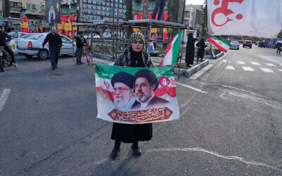 A woman holds a banner showing portraits of the late Iranian Supreme Leader Ayatollah Ali Khamenei, left, and his son Ayatollah Mojtaba Khamenei, the successor to him, during a campaign in support of the government. downtown Tehran, Iran, March 30, 2026. (AP Photo/Vahid Salemi) A woman holds a banner showing portraits of the late Iranian Supreme Leader Ayatollah Ali Khamenei, left, and his son Ayatollah Mojtaba Khamenei, the successor to him, during a campaign in support of the government. downtown Tehran, Iran, March 30, 2026. (AP Photo/Vahid Salemi)