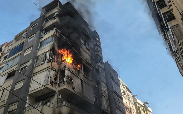 Flames rise from an apartment targeted by an Israeli airstrike in central Beirut on March 18, 2026. (Fadel Itani/AFP)