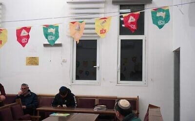 Residents of Beit Shemesh attend a Purim megillah reading on March 2, 2026. (Charlie Summers/Times of Israel)