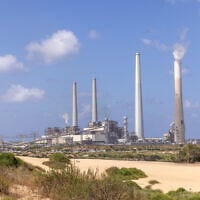 View of the Orot Rabin power plant in coastal Hadera from the Sdot Yam beach, central Israel, May 20, 2023. In a controversial move, the government is allowing the plant to retain coal for emergency backup. (Yossi Aloni/FLASH90)