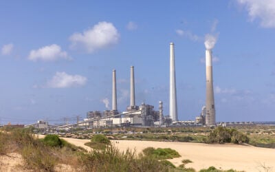 View of the Orot Rabin power plant in coastal Hadera from the Sdot Yam beach, central Israel, May 20, 2023. In a controversial move, the government is allowing the plant to retain coal for emergency backup. (Yossi Aloni/FLASH90) View of the Orot Rabin power plant in coastal Hadera from the Sdot Yam beach, central Israel, May 20, 2023. In a controversial move, the government is allowing the plant to retain coal for emergency backup. (Yossi Aloni/FLASH90)