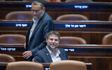 Finance Minister Bezalel Smotirch and United Torah Judaism MK Moshe Gafni attend a Knesset budget debate, December 16, 2024. (Chaim Goldberg FLASH90)