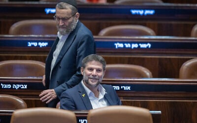 Finance Minister Bezalel Smotirch and United Torah Judaism MK Moshe Gafni attend a Knesset budget debate, December 16, 2024. (Chaim Goldberg FLASH90)