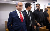Prime Minister Benjamin Netanyahu arrives at the courtroom at the District Court in Tel Aviv, before the start of his testimony in the trial against him, October 28, 2025. (Miriam Alster/Flash90)
