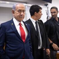 Prime Minister Benjamin Netanyahu arrives at the courtroom at the District Court in Tel Aviv, before the start of his testimony in the trial against him, October 28, 2025. (Miriam Alster/ Flash90/ File)