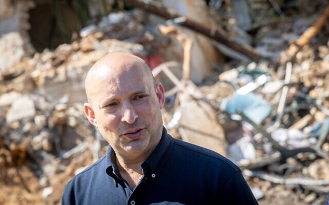 Former prime minister Naftali Bennett at the scene of an Iranian ballistic missile impact in Tel Aviv on March 1, 2026 (Chaim Goldberg/Flash90) Former prime minister Naftali Bennett at the scene of an Iranian ballistic missile impact in Tel Aviv on March 1, 2026 (Chaim Goldberg/Flash90)