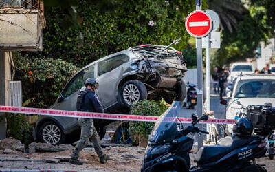 Emergency services at the scene of a ballistic missile attack from Iran, in Tel Aviv, March 8, 2026. (Chaim Goldberg/Flash90) Emergency services at the scene of a ballistic missile attack from Iran, in Tel Aviv, March 8, 2026. (Chaim Goldberg/Flash90)