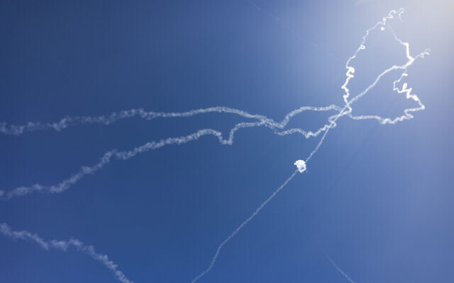 The trails after aerial defenses are activated against missile fire from Iran, as seen over Jerusalem, March 12, 2026 (Yonatan Sindel/Flash90) The trails after aerial defenses are activated against missile fire from Iran, as seen over Jerusalem, March 12, 2026 (Yonatan Sindel/Flash90)