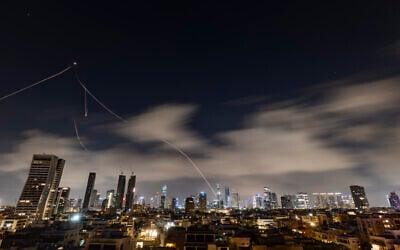 Anti-missile batteries fire interceptors toward incoming ballistic missiles launched from Iran, as seen over Tel Aviv, March 15, 2026. (Chaim Goldberg/Flash90)
