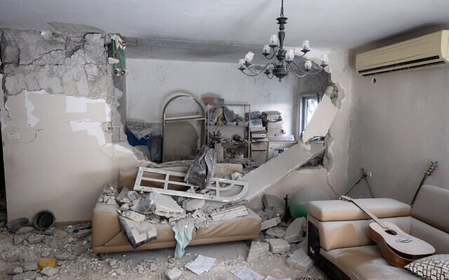 The scene where a missile fired from Iran at Israel caused damage to a house in Rishon Lezion, March 16, 2026. (Chaim Goldberg/Flash90) The scene where a missile fired from Iran at Israel caused damage to a house in Rishon Lezion, March 16, 2026. (Chaim Goldberg/Flash90)