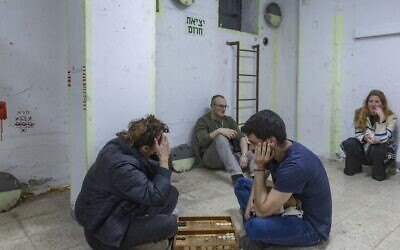 People take cover in a bomb shelter from incoming missiles fired from Iran in Tel Aviv, March 16, 2026. (Chaim Goldberg/Flash90) People take cover in a bomb shelter from incoming missiles fired from Iran in Tel Aviv, March 16, 2026. (Chaim Goldberg/Flash90)