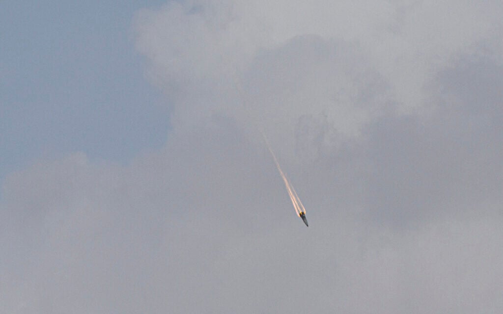 Part of a missile, likely its warhead, falls after being intercepted by Israeli air defense systems during an Iranian missile attack. The missile part struck the Old City of Jerusalem, March 20, 2026. (Yonatan Sindel/Flash90)