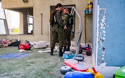 First responders work at the scene where an Iranian cluster bomb submunition hit a kindergarten in Rishon Lezion on March 21, 2026. (Avshalom Sassoni/Flash90) First responders work at the scene where an Iranian cluster bomb submunition hit a kindergarten in Rishon Lezion on March 21, 2026. (Avshalom Sassoni/Flash90)