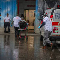 People injured in a Hezbollah missile strike on Kiryat Shmona arrive at Ziv Medical Center in Safed, northern Israel, March 23, 2026. (David Cohen/Flash90)