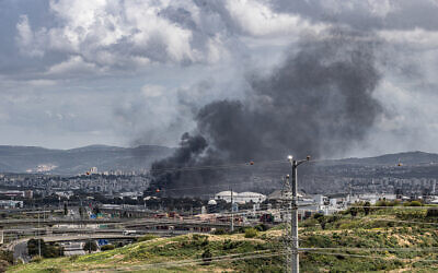 Smoke rises from the Bazan oil refinery in Haifa, following missile attacks from Iran and Lebanon, March 30, 2026. (Anthony Hershko/Flash90)