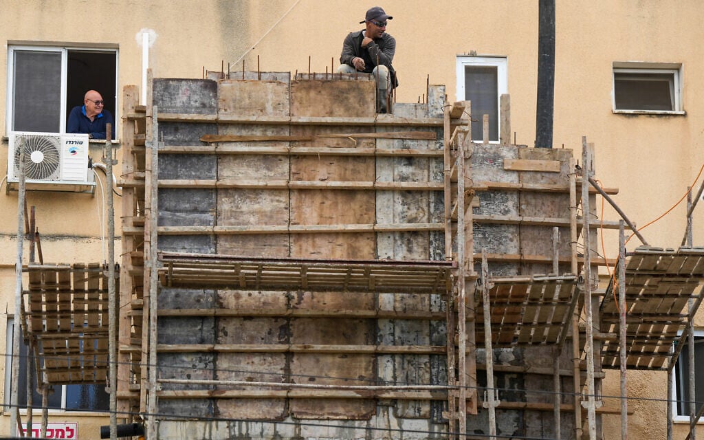 Workers build reinforced safe rooms in the northern city of Kiryat Shmona, March 31, 2026. (Ayal Margolin/Flash90) Workers build reinforced safe rooms in the northern city of Kiryat Shmona, March 31, 2026. (Ayal Margolin/Flash90)