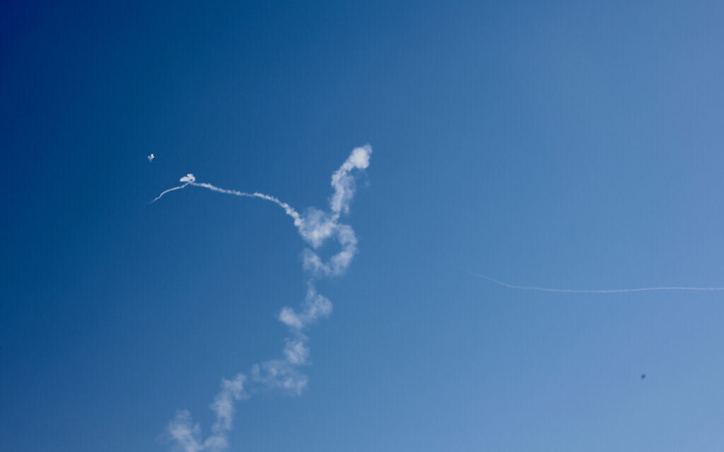 Smoke trails are seen as missiles launched from Iran toward Israel are intercepted by Israeli air defenses, March 4, 2026. (Oren Cohen/Flash90)