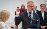German politician Andreas Büttner is sworn in during the state parliament session following his election as Brandenburg's antisemitism commissioner, with members of his Left party in the background, June 20 2024. (Soeren Stache/picture alliance via Getty Images/ via JTA)