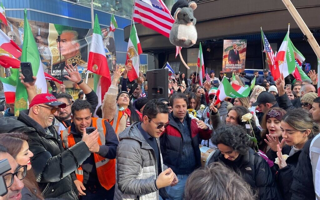 A crowd led by Iranian Americans rallies for the US and Israel in Times Square amid the US-Israeli air campaign against the Iranian regime on March 1, 2026. (Luke Tress/Times of Israel)