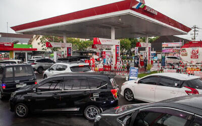 Cars queue at a gas station in Indonesia as the closure of the Strait of Hormuz prompted Indonesia to consider a weekly work-from-home policy to cut fuel use, in Yogyakarta on March 28, 2026. (Devi Rahman/AFP)