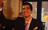 Andrew Ginsburg celebrates after winning a JFK Jr. look-alike competition in the West Village. (Courtesy Andrew Ginsberg via JTA)
