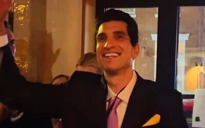 Andrew Ginsburg celebrates after winning a JFK Jr. look-alike competition in the West Village. (Courtesy Andrew Ginsberg via JTA) Andrew Ginsburg celebrates after winning a JFK Jr. look-alike competition in the West Village. (Courtesy Andrew Ginsberg via JTA)