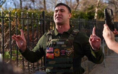 Far-right influencer Jake Lang speaks in front of Gracie Mansion at a protest he organized on March 9, 2026, in New York City. (Ryan Murphy/Getty Images via JTA)