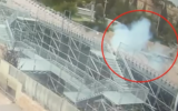 Smoke rises from where the warhead of an Iranian ballistic missile fell in the Sultan’s Pool outdoor venue just meters from the Old City of Jerusalem, February 28, 2026. (Screenshot, courtesy, Israel Police Spokesperson’s Department)