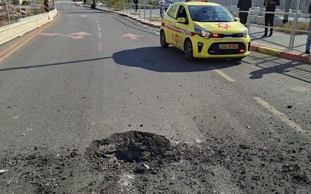 A Magen David Adom vehicle is seen next to damage caused by an Iranian missile strike in central Israel, on March 3, 2026. (Magen David Adom)