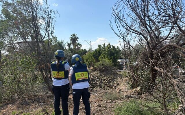 Medics at the site of an Iranian ballistic missile impact in a town in central Israel, March 5, 2026. (Magen David Adom)